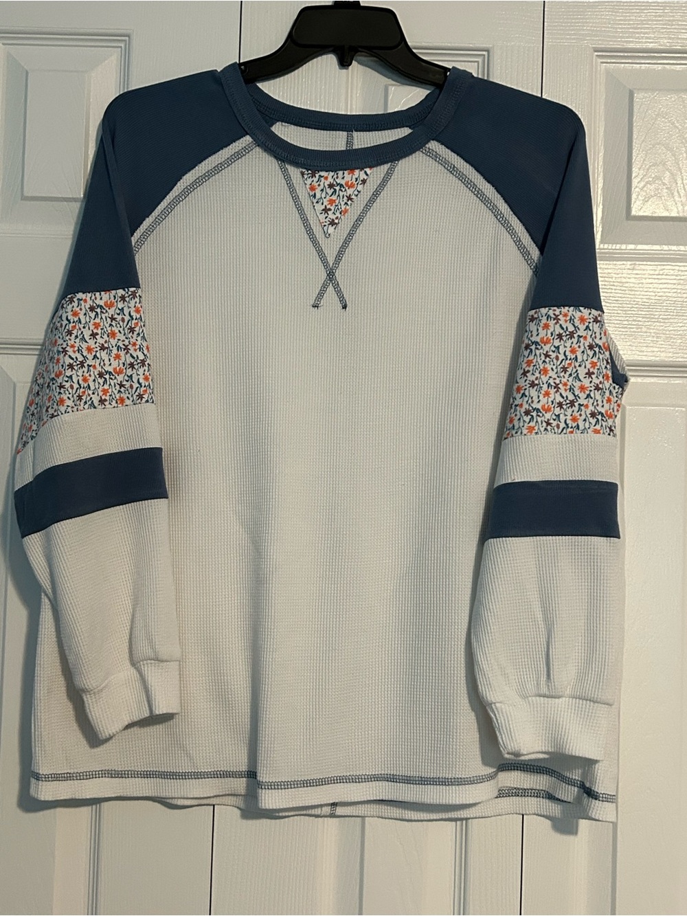 Waffle-Knit Crewneck Top with Blue Accents and Floral Sleeve Panels